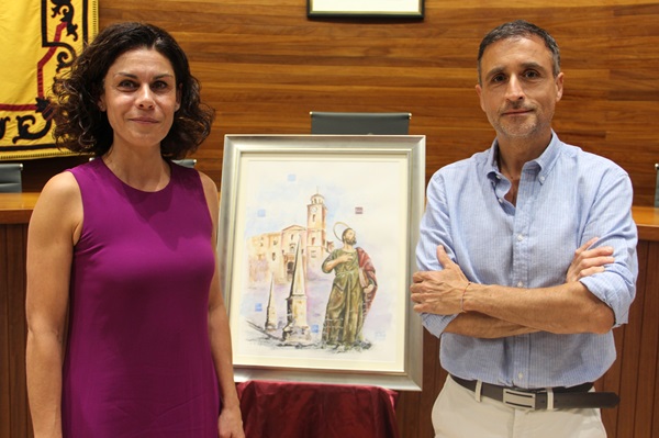 Antonio Pellicer y la alcaldesa Mari Carmen Morales posan junto al cuadro de fiestas